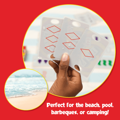 A hand holding a complete SET at the beach